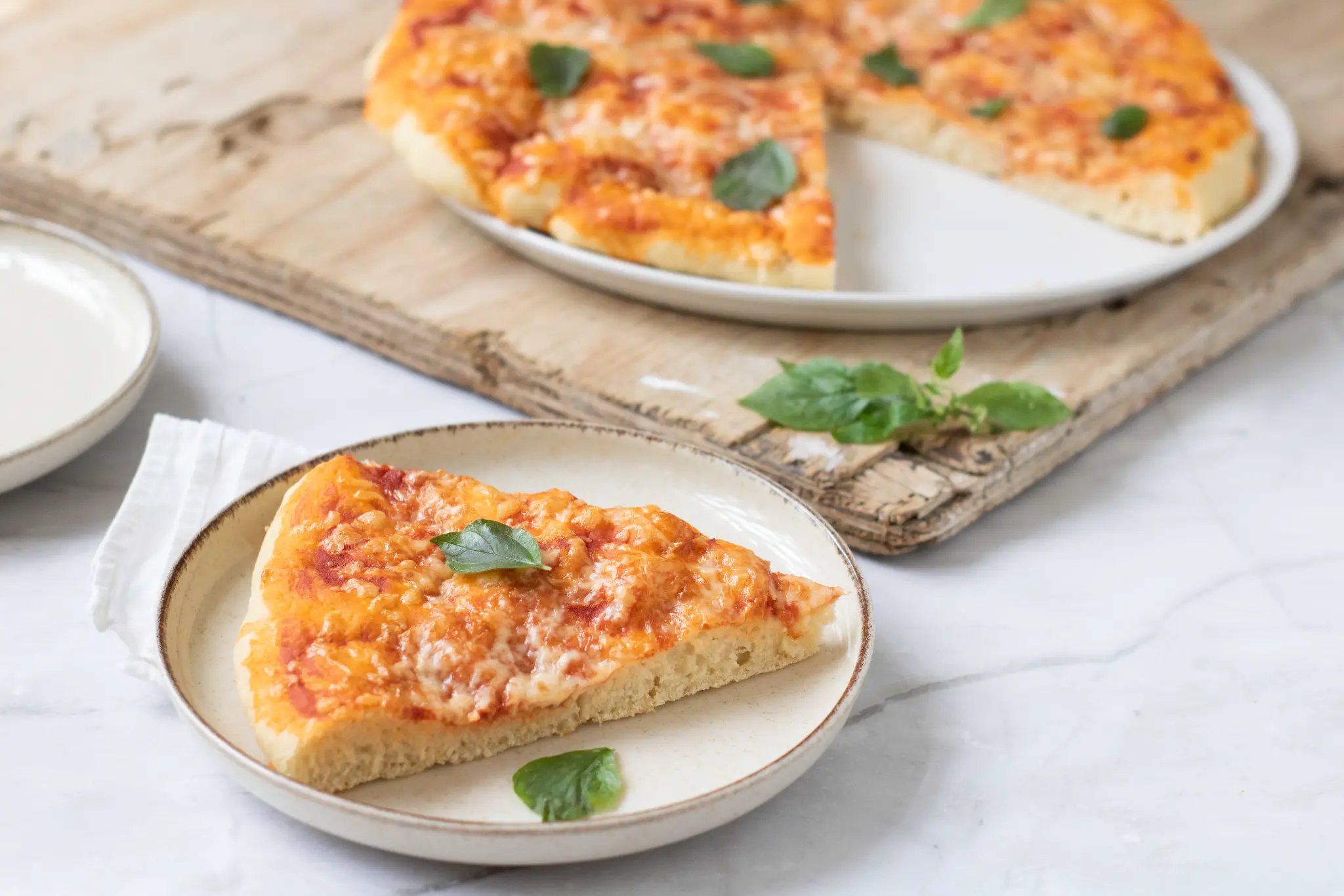 Pizza slices on ceramic plates