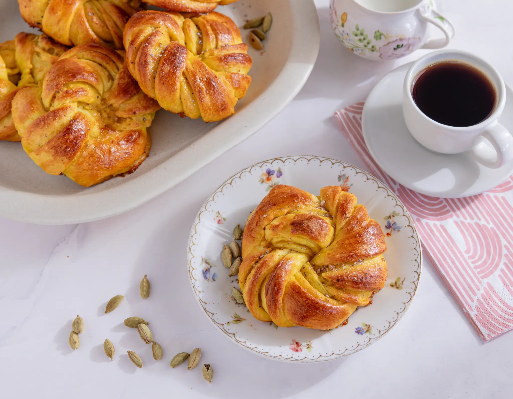 Golden saffron cardamom buns with coffee